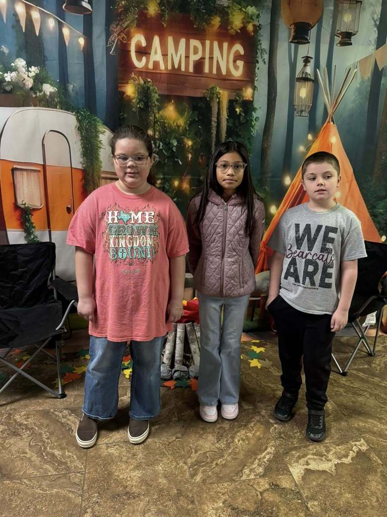 three happy campers of the week standing in front of camping background