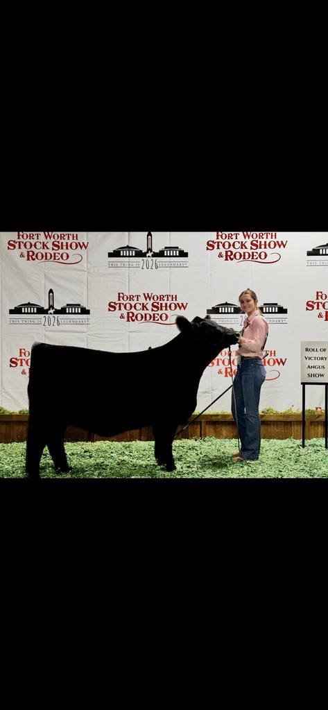 ffa member posing with her heifer