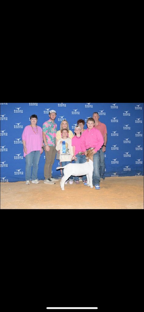 calhoun family and show goat at stock show