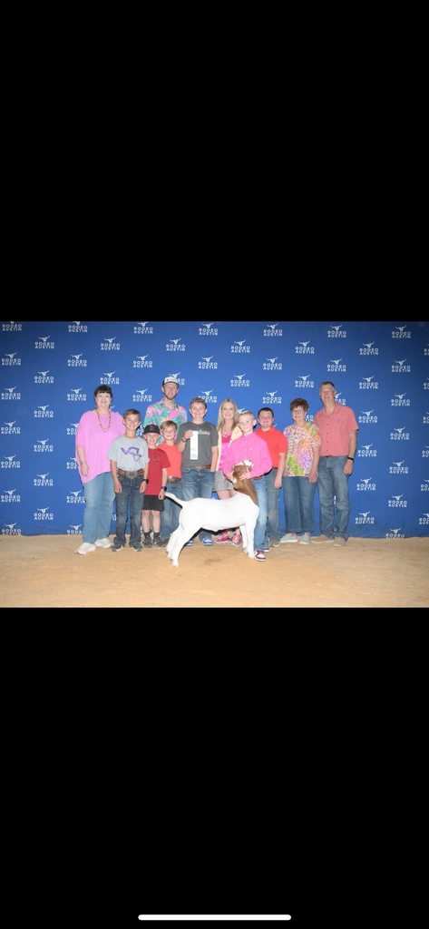 calhoun family and show goat at stock show