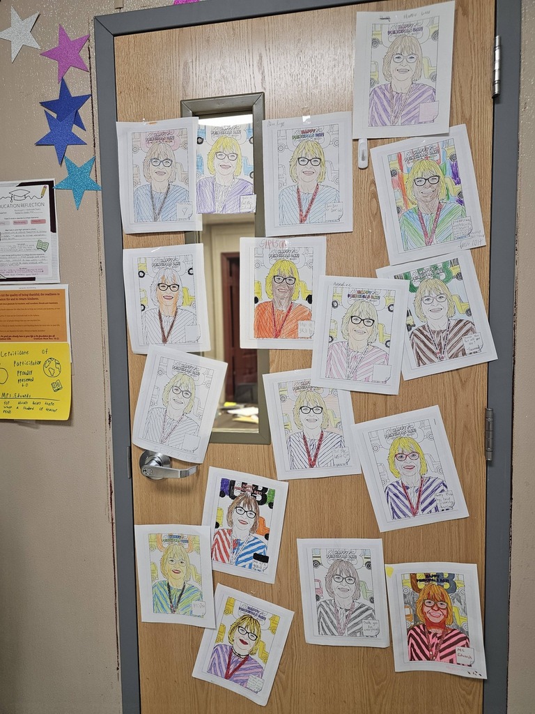 printouts of principal colored by students posted on principal's door