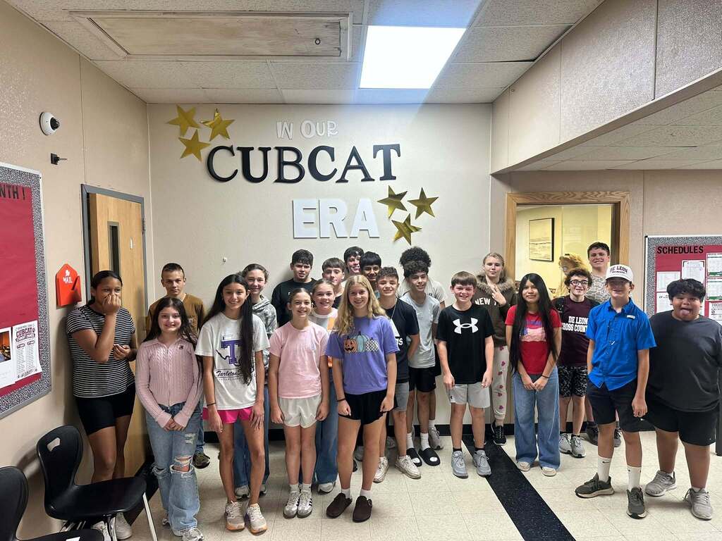 a group of Cubcats of the Week standing in hallway