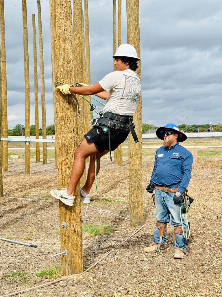 student climbing pole