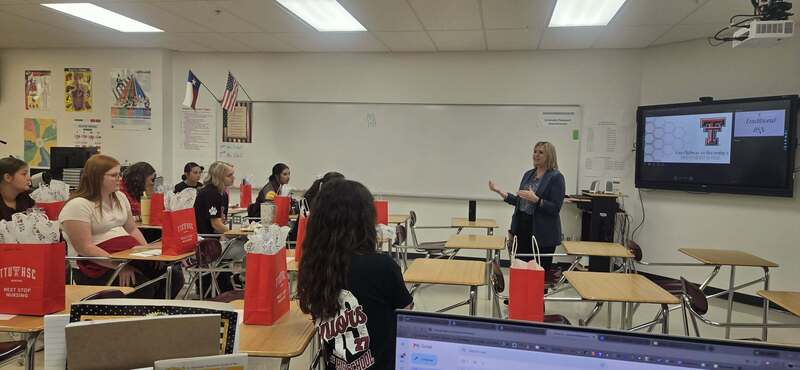 guest speaker talking to students in classroom