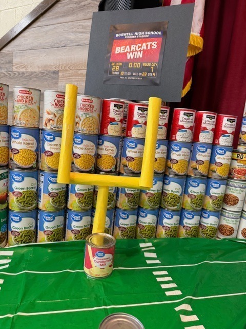 wall made of canned foods and field goal post