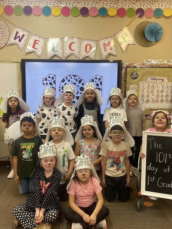 group of students dressed as dalmatians posing to picture