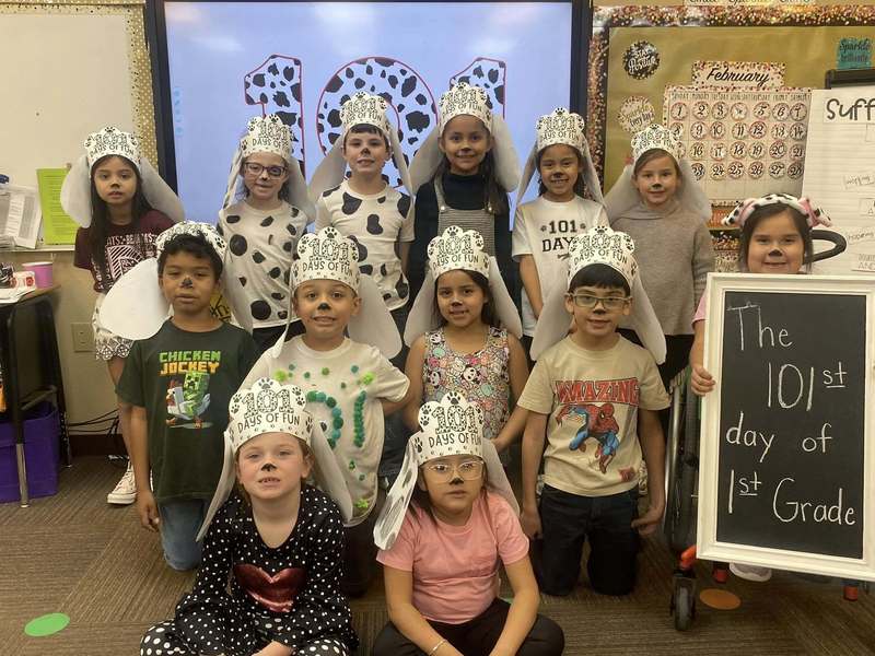 group of students dressed as dalmatians posing to picture