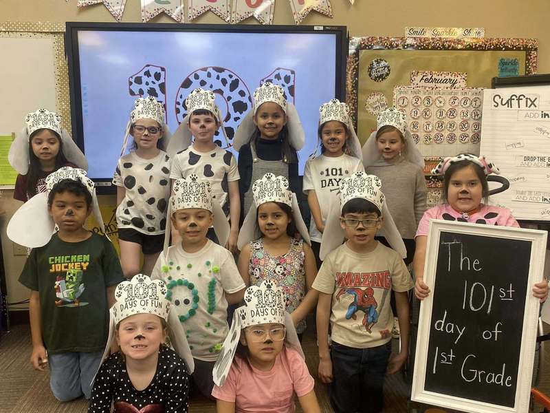 group of students dressed as dalmatians posing to picture