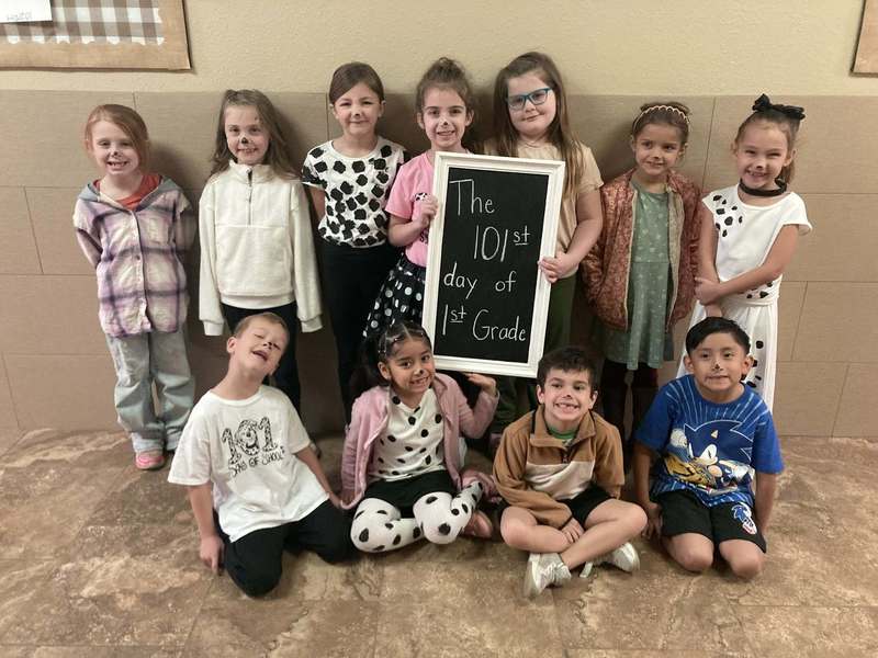 group of students dressed as dalmatians posing to picture