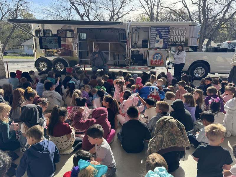 group of students listening to dairy speaker