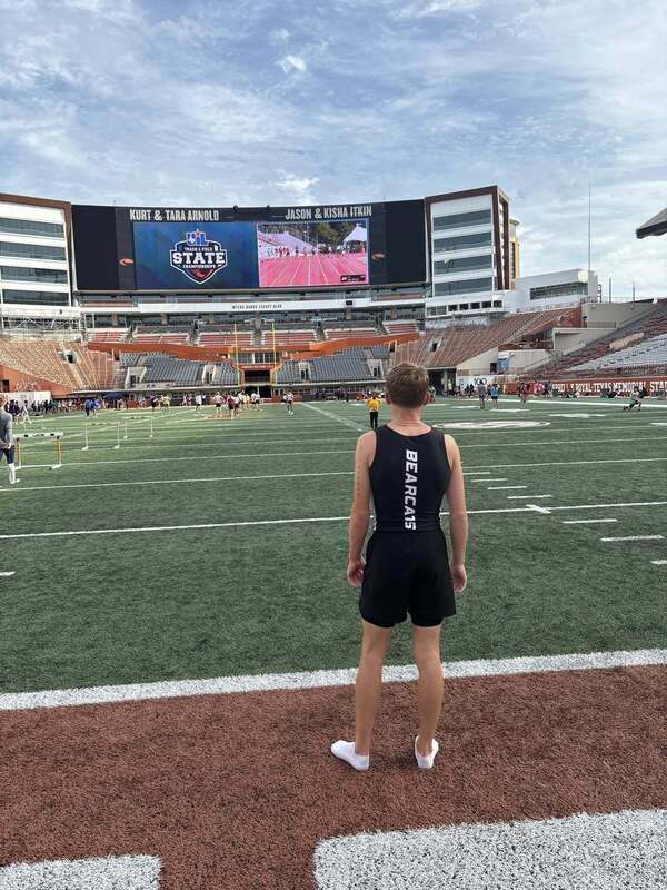 athlete standing in the end zone at UT in Austin football field