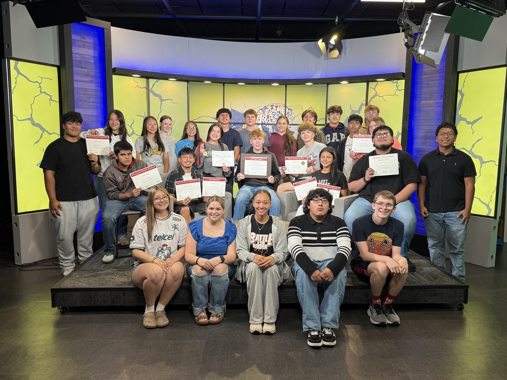 DQTV Students in studio holding award certificates