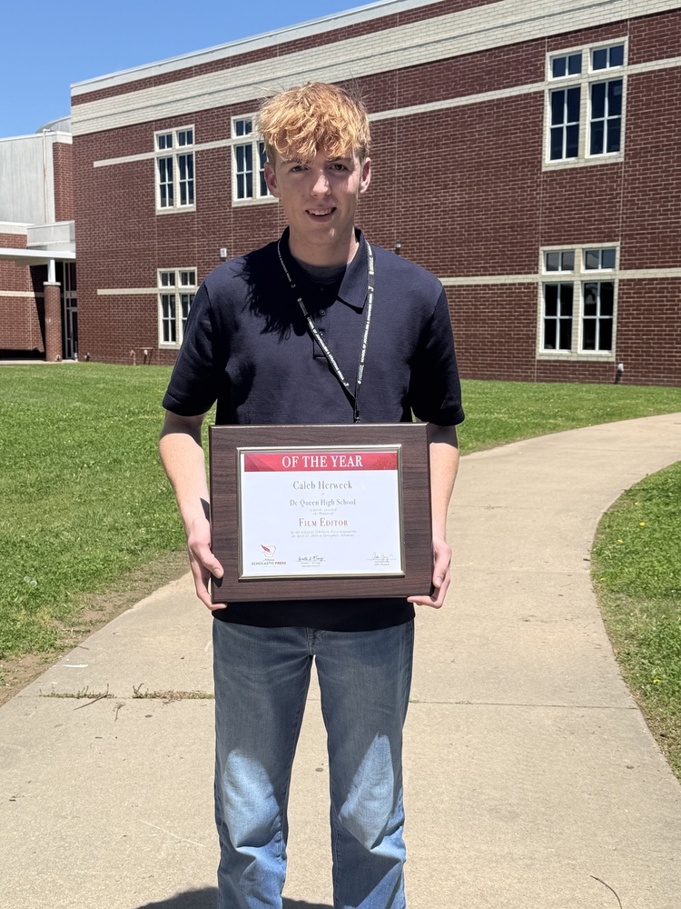 Caleb herweck holding plaque for Film Editor of the year