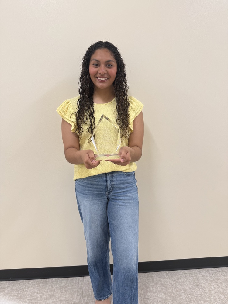 Azulenny Ponce holding trophy for perfect attendance