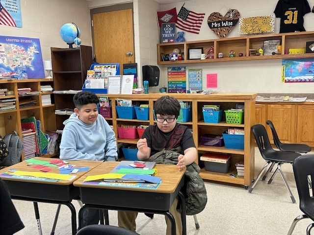 3rd graders studying fractions.