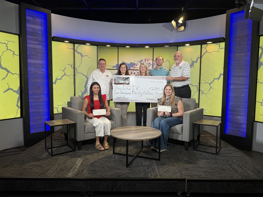 DQTV Interns hold check presented by Bunyard Broadcasting along with a large check written to DQTV and with representatives of Bunyard Broadcasting.