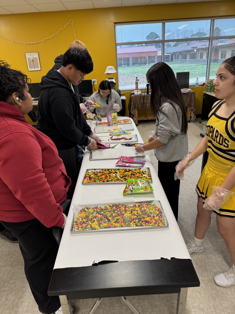 Leopard Den students preparing freeze dried candy products