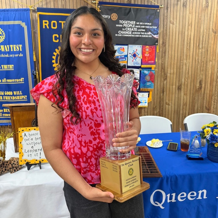 Azulenny Ponce holds Rotary Crystal Award
