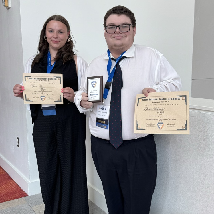 Efrain and Virginia holding FBLA awards