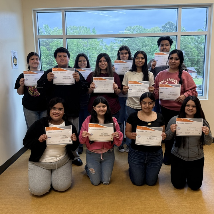 Students holding certificates 