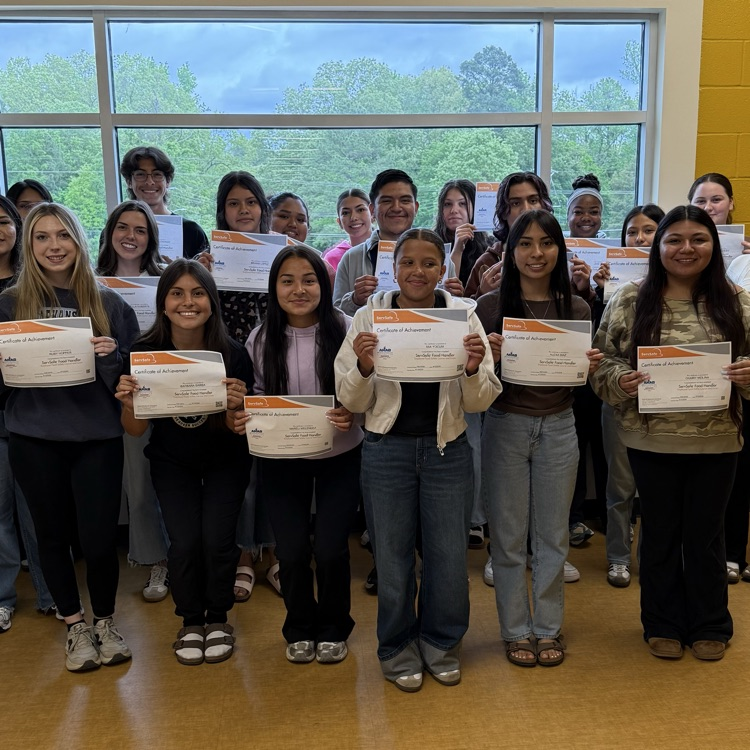 Students holding certificates 