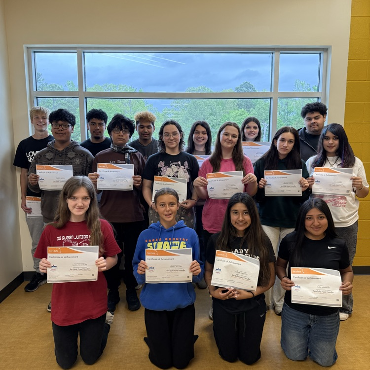 Students holding certificates 