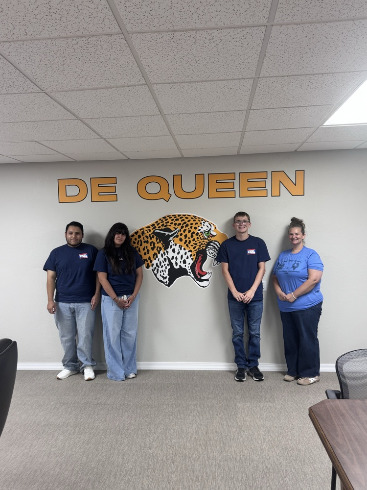 TSA students standing by the leopard logo