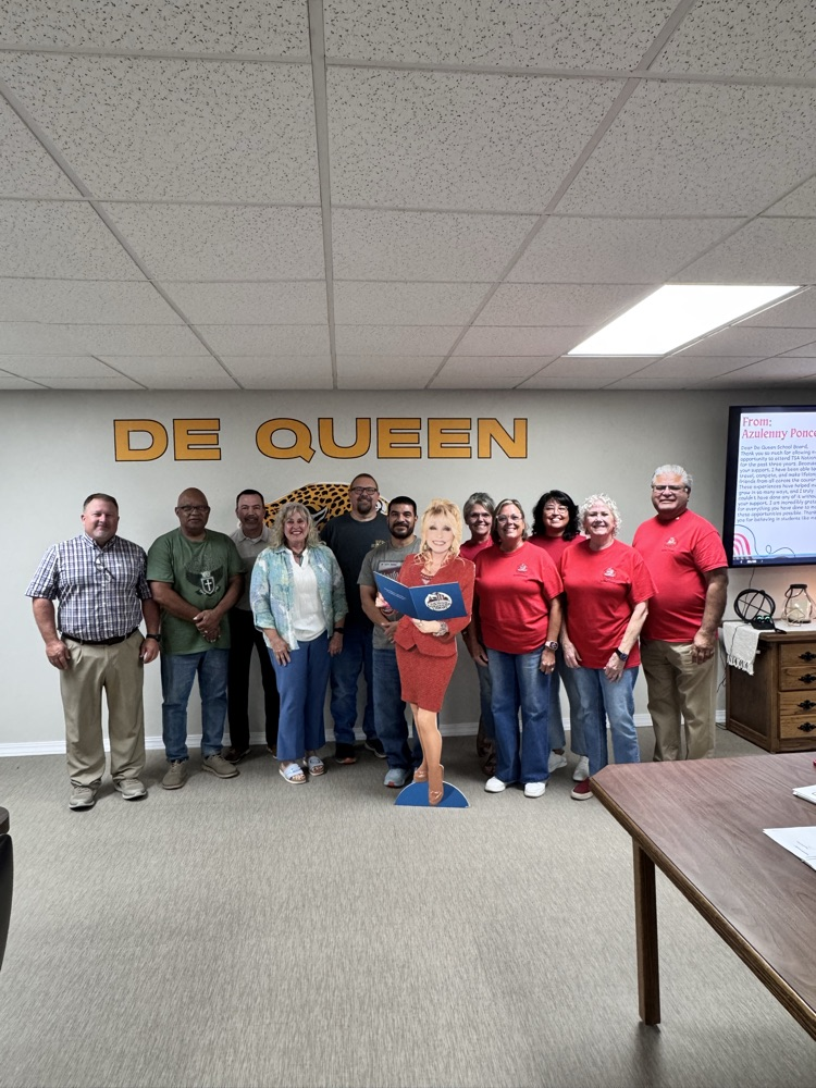 Members of the Rotary club with DeQueen school board and cut out of Dolly Parton