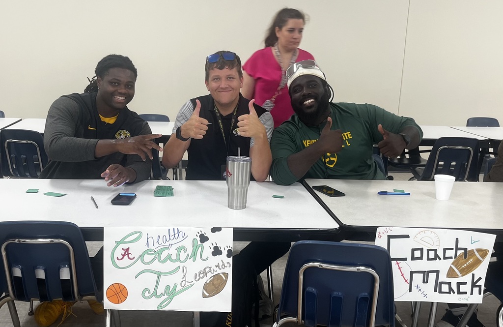 Coach Ty, Coach Mack & Coach Beasley giving a thumbs up.