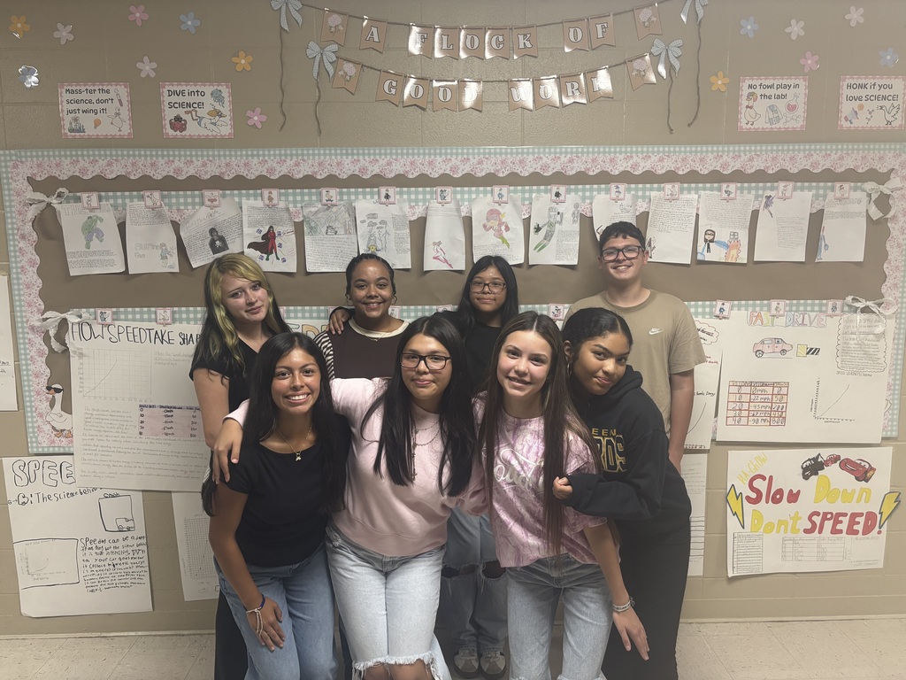 Student council members standing in classroom.