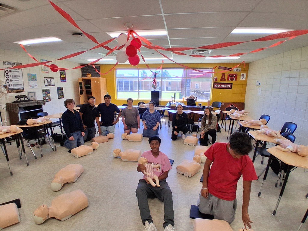 Students learning and practicing CPR