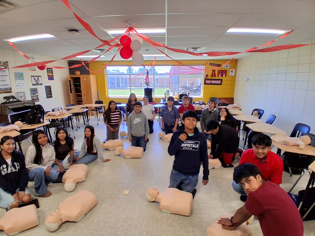 Students learning and practicing CPR