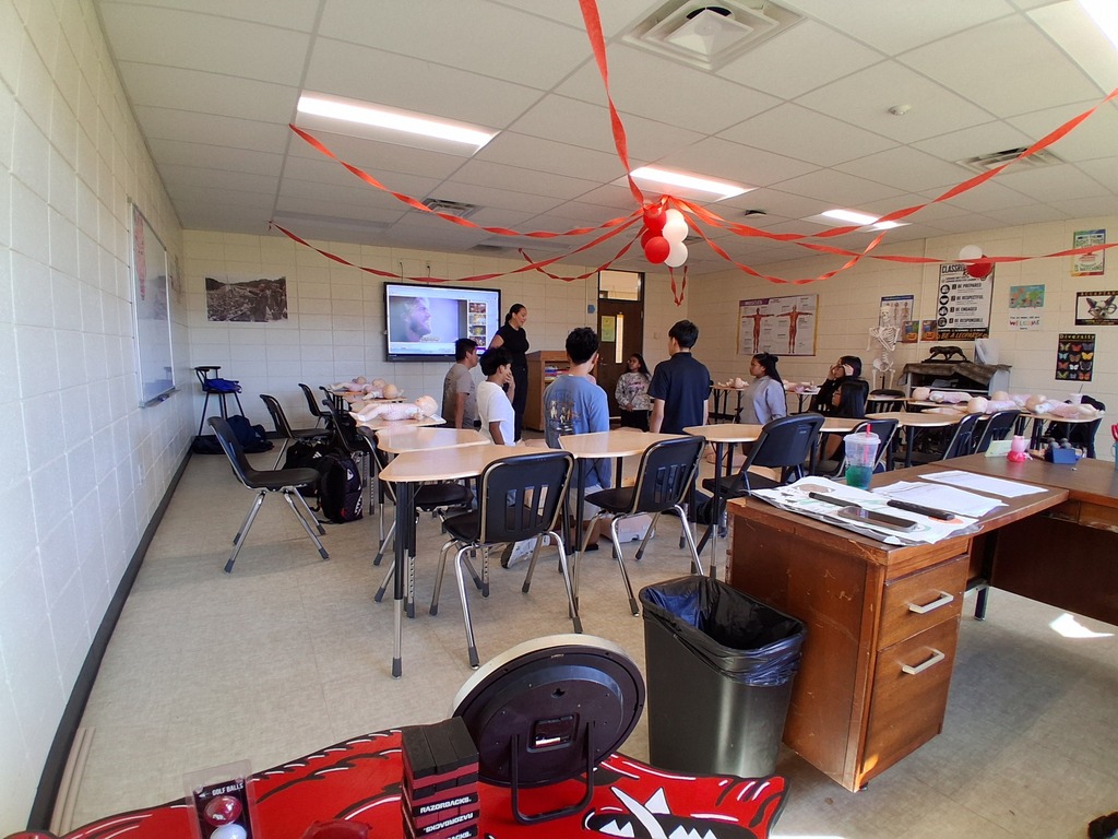 Students learning and practicing CPR