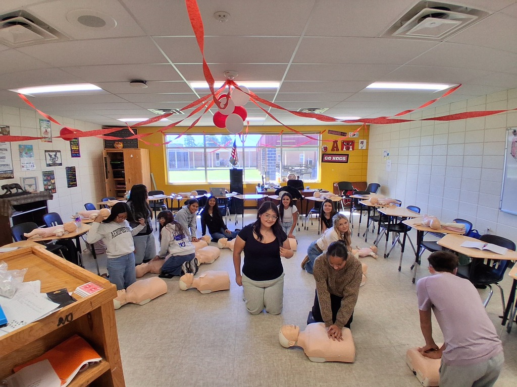 Students learning and practicing CPR