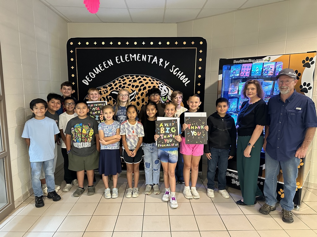 Thanking Marty and Mandy Hooker from Tires Plus for sponsoring our book vending machine.