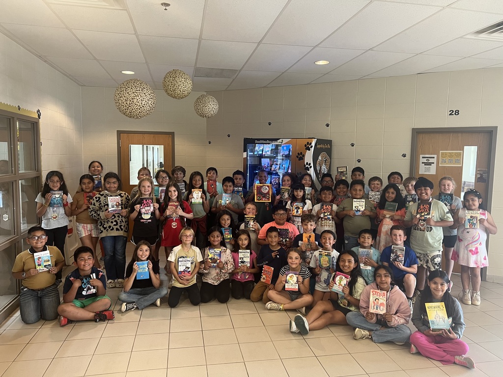 These DES students earned the opportunity to get a free book from the ne Book Vending Machine.