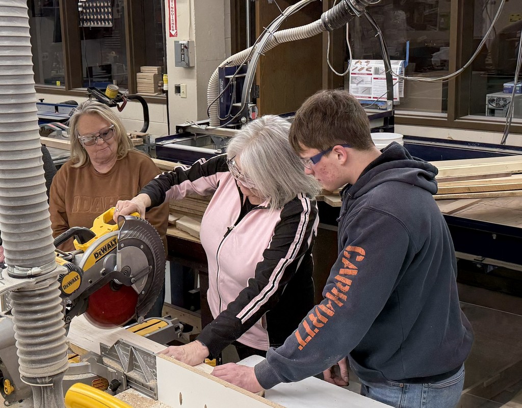 Student helping community member