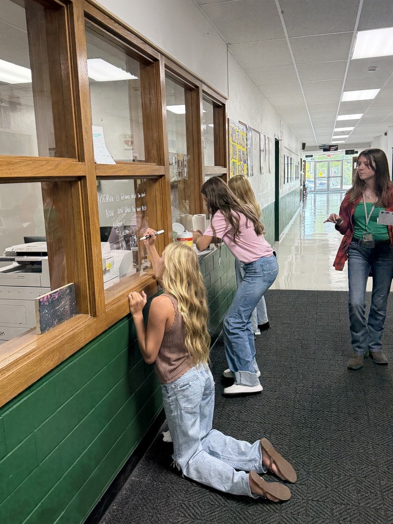 Students working on window art.