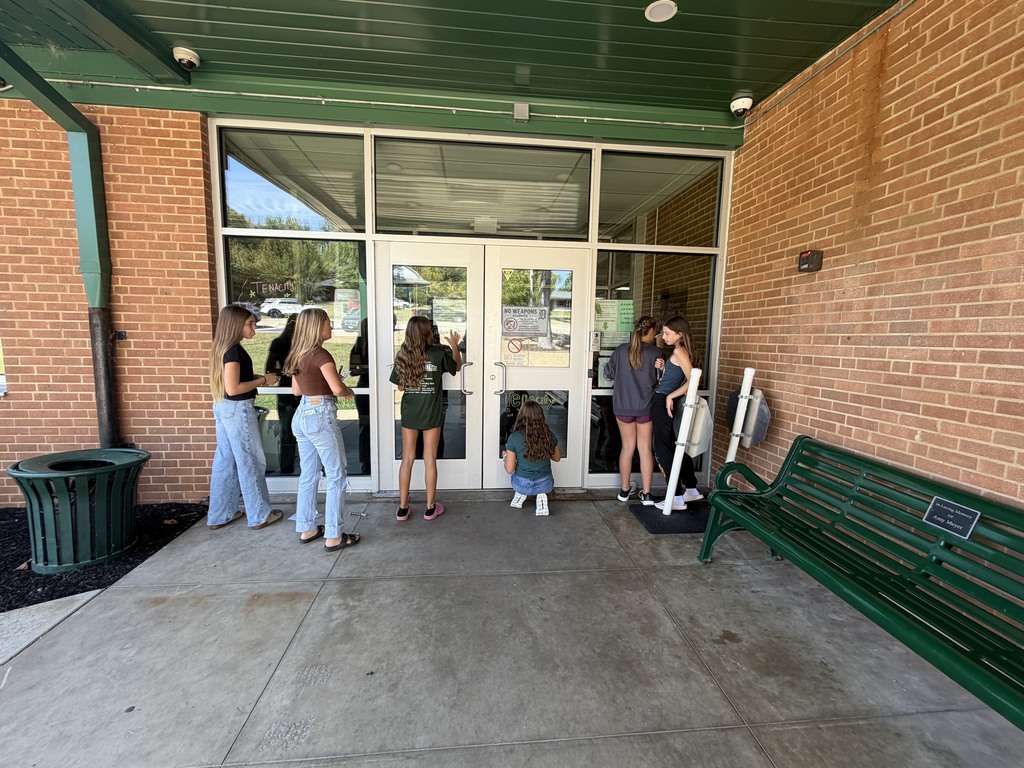 Students working on window art.