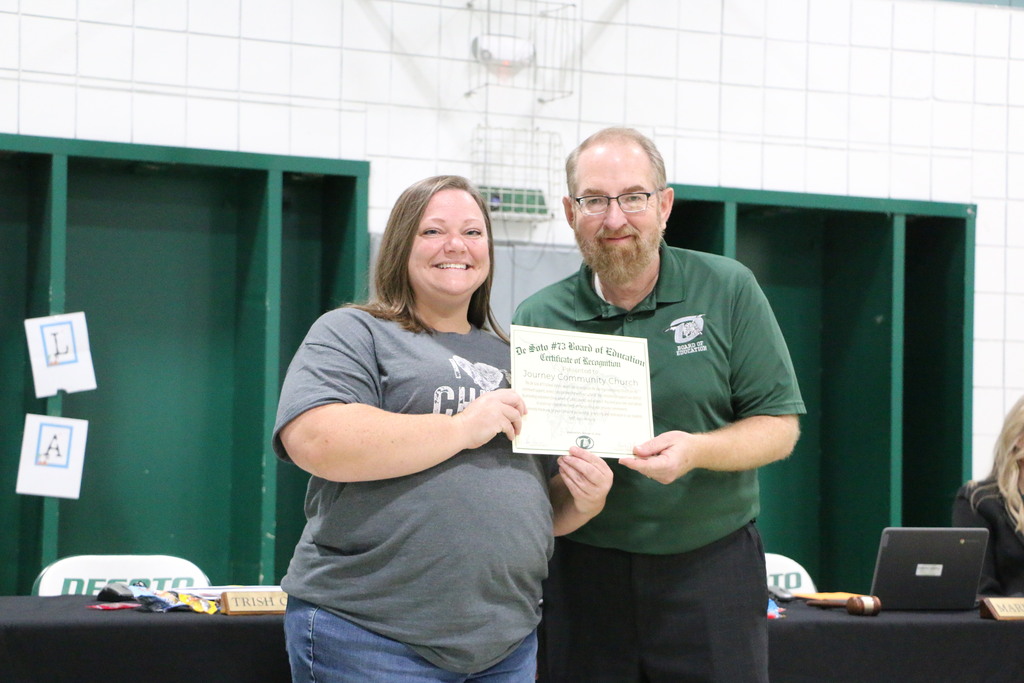 Photo of board of education and community member. 