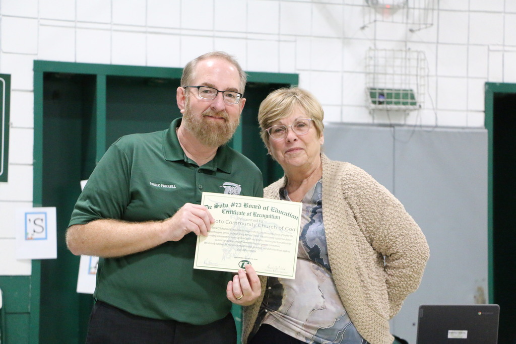 Photo of board of education and community member.
