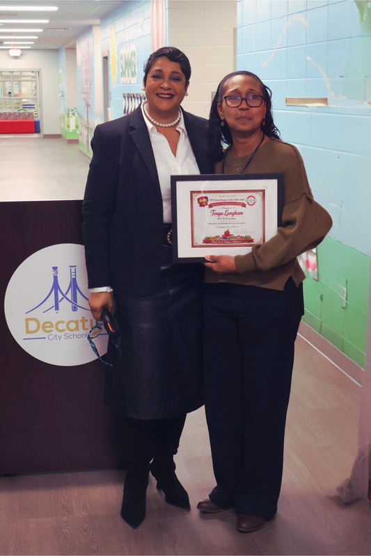 Image of Dr. Yvette Evans and Tonya Langham after winning PERK Award