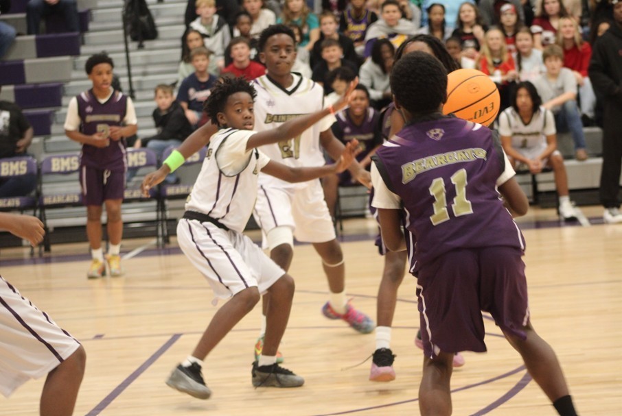 Middle School students playing basketball