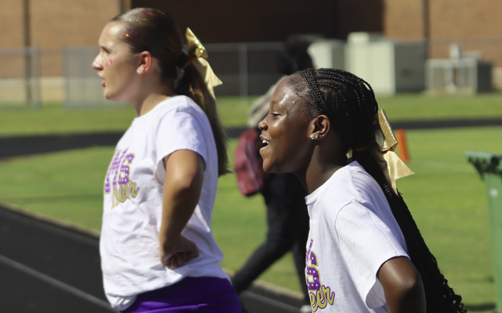bms football cheerleaders cheering outside at a game