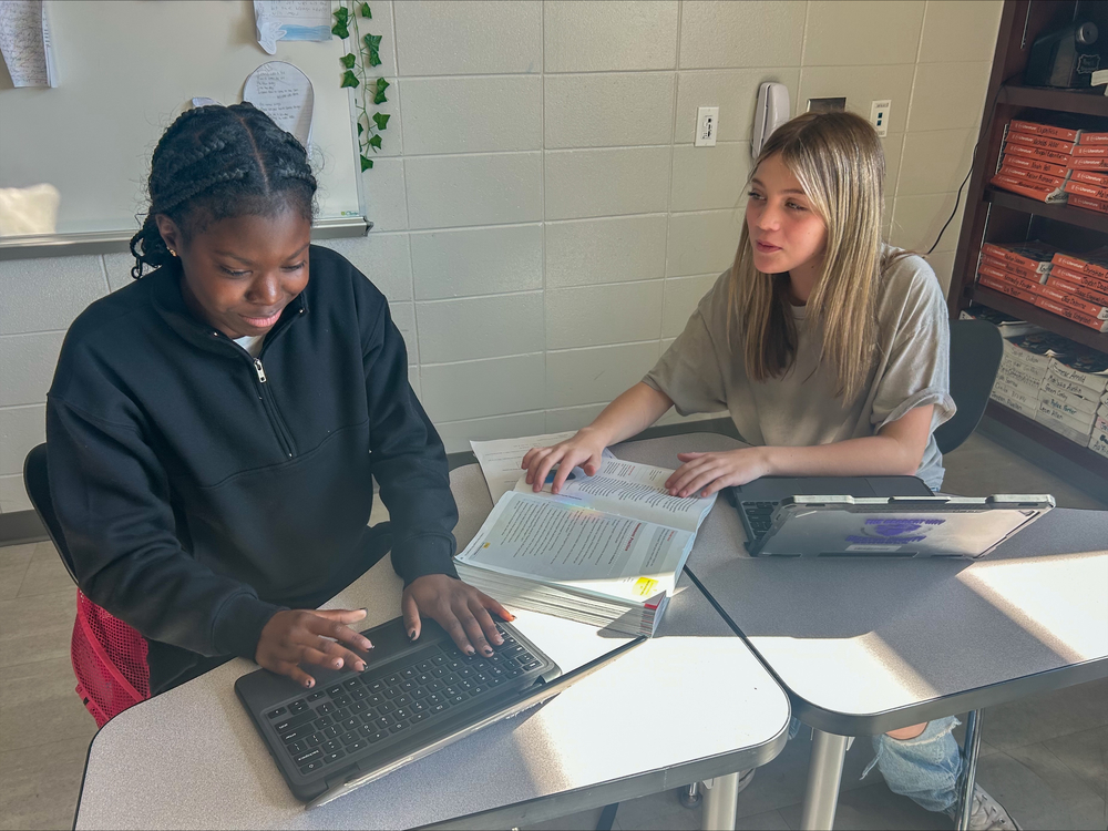 Students collaborating with ELA work