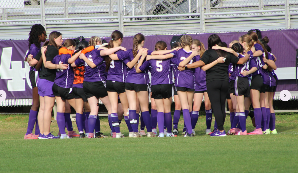 BMS Girls Soccer Team huddled up
