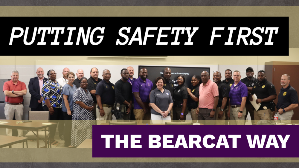 Group photo of Decatur County Schools administrators and local law enforcement officers with the text 'Putting Safety First – The Bearcat Way' displayed above and below the image