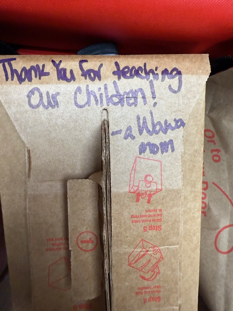 Sign with handwritten text reading "Thank you for teaching our chicken! -a Wawa mom."
