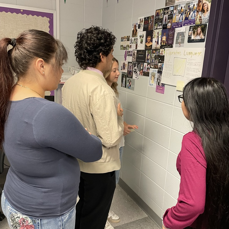 AP Lit students complete a gallery walk where they view their classmates' analysis of five skills using "The Yellow Wallpaper."