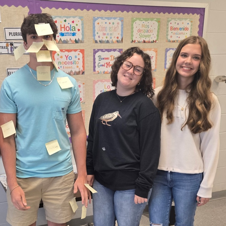 Students in Mrs. Wallace's Spanish 1 class reviewed the body parts by labeling their classmates using the Spanish words. 